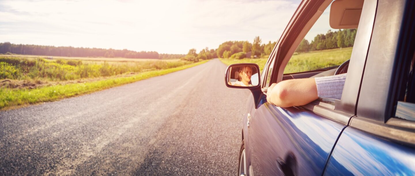 Illinois drivers license reinstatement - driver on open road after successful license reinstatement